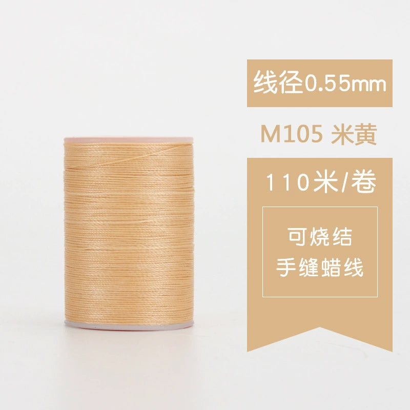 Waxed leather stitching thread spool with light beige thread