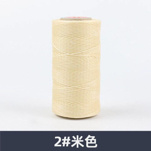 Beige waxed polyester sewing thread spool, flat 150D