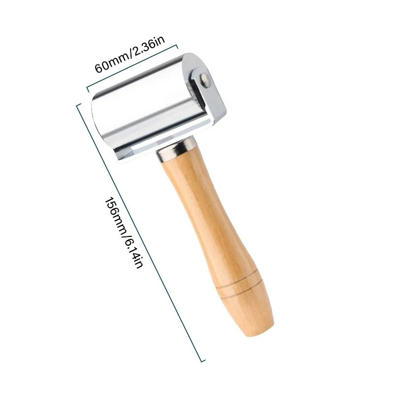 Leather roller press with 60mm chrome roller and light wood handle, 156mm