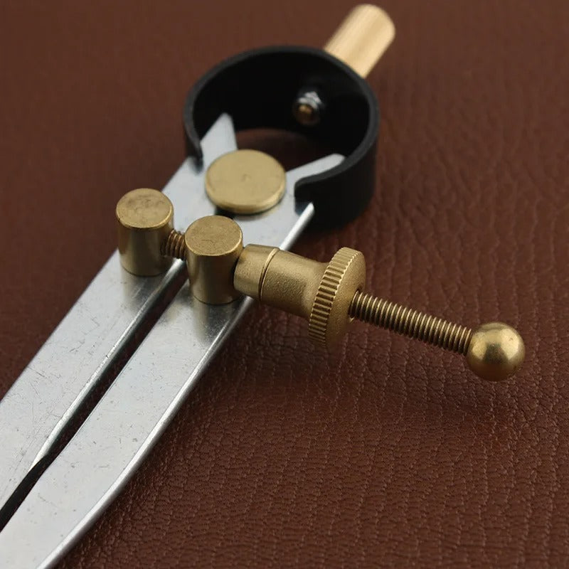 Wing divider tool with lockable adjustment, brass adjustment rod on black clamp