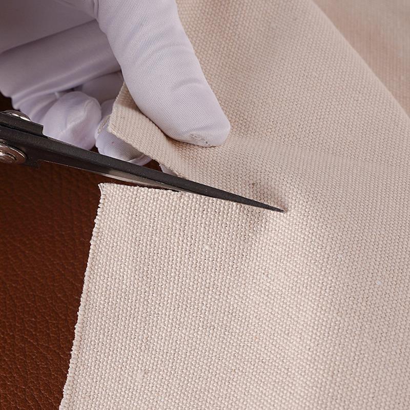 Beige polishing cloth buffing a leather edge