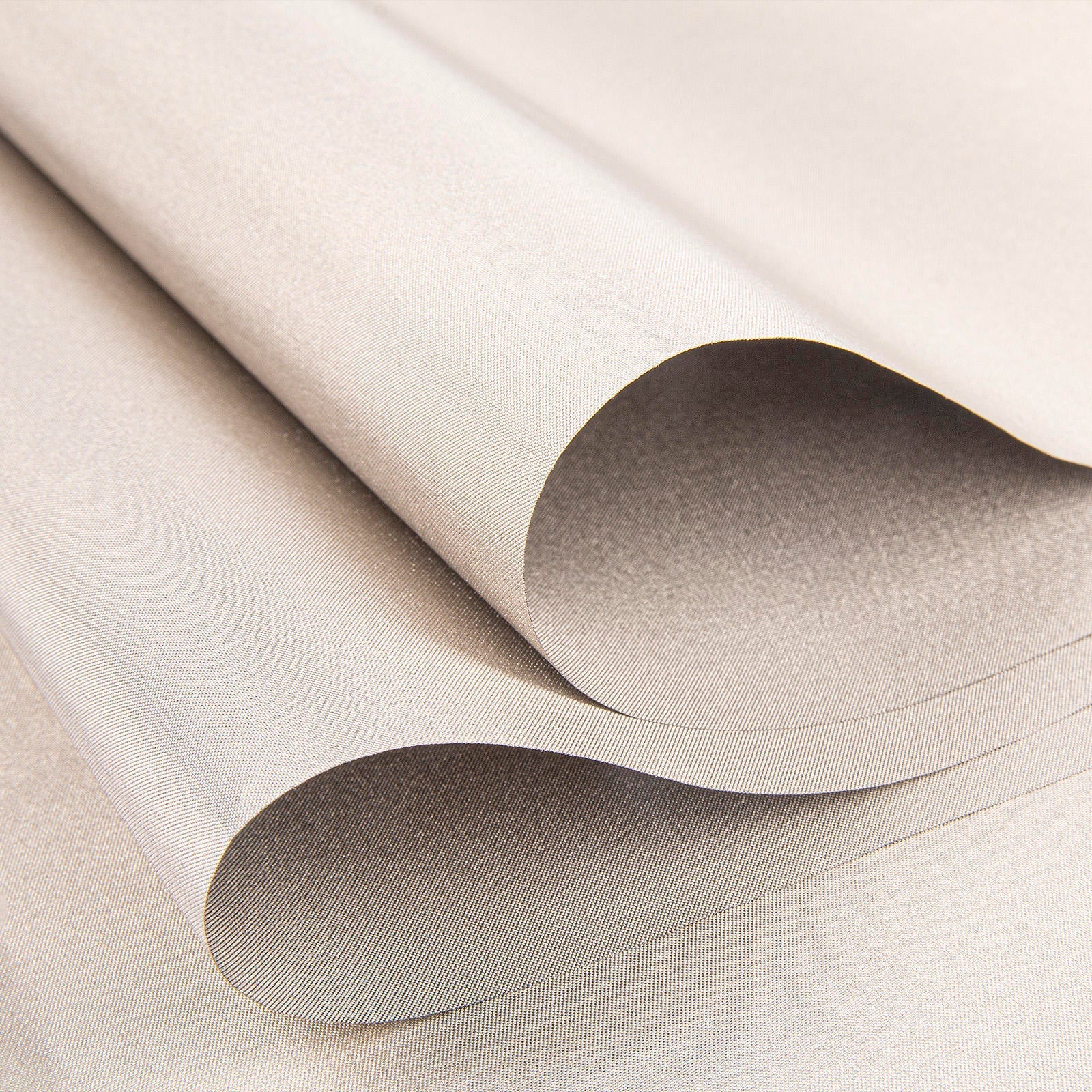 Light silver-gray conductive shielding fabric roll with rounded folds and fine weave