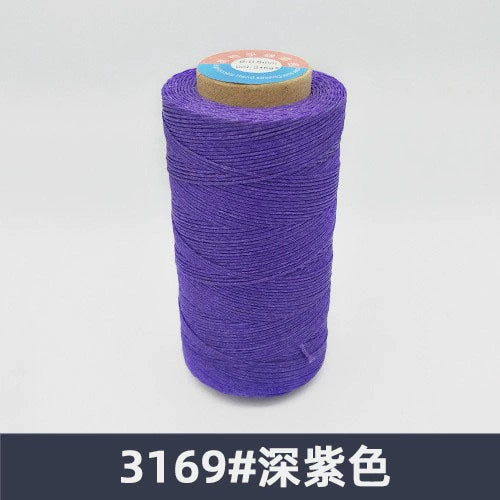Waxed polyester sewing thread spool, deep violet purple