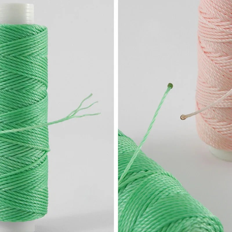 Green and pale pink waxed round thread on spools