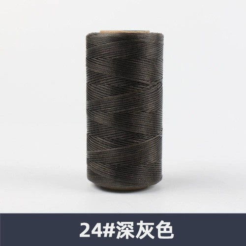 Waxed polyester sewing thread spool, dark gray