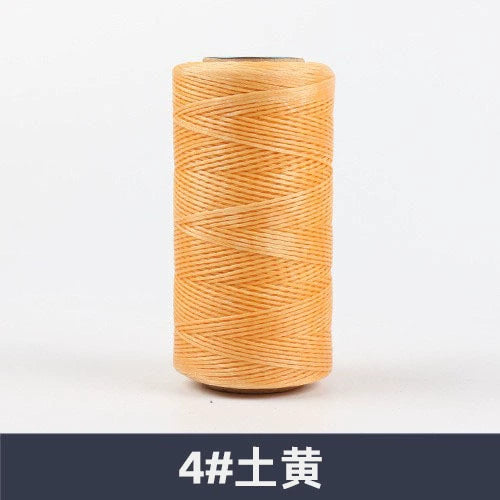 Light orange waxed polyester sewing thread spool, flat 150D